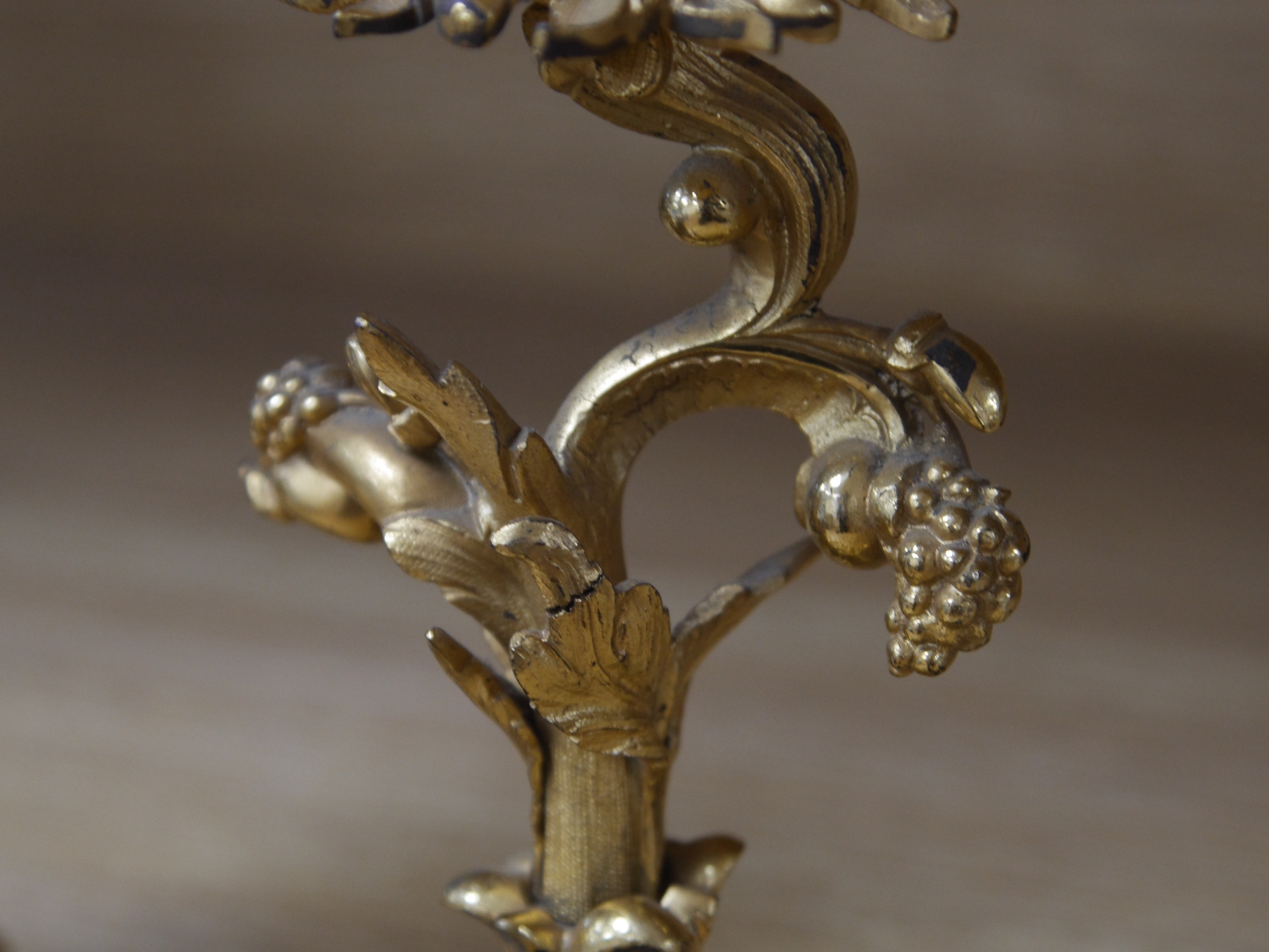 A pair of Louis XV-style ormolu candlesticks, 21cm high. Condition - slight tarnishing